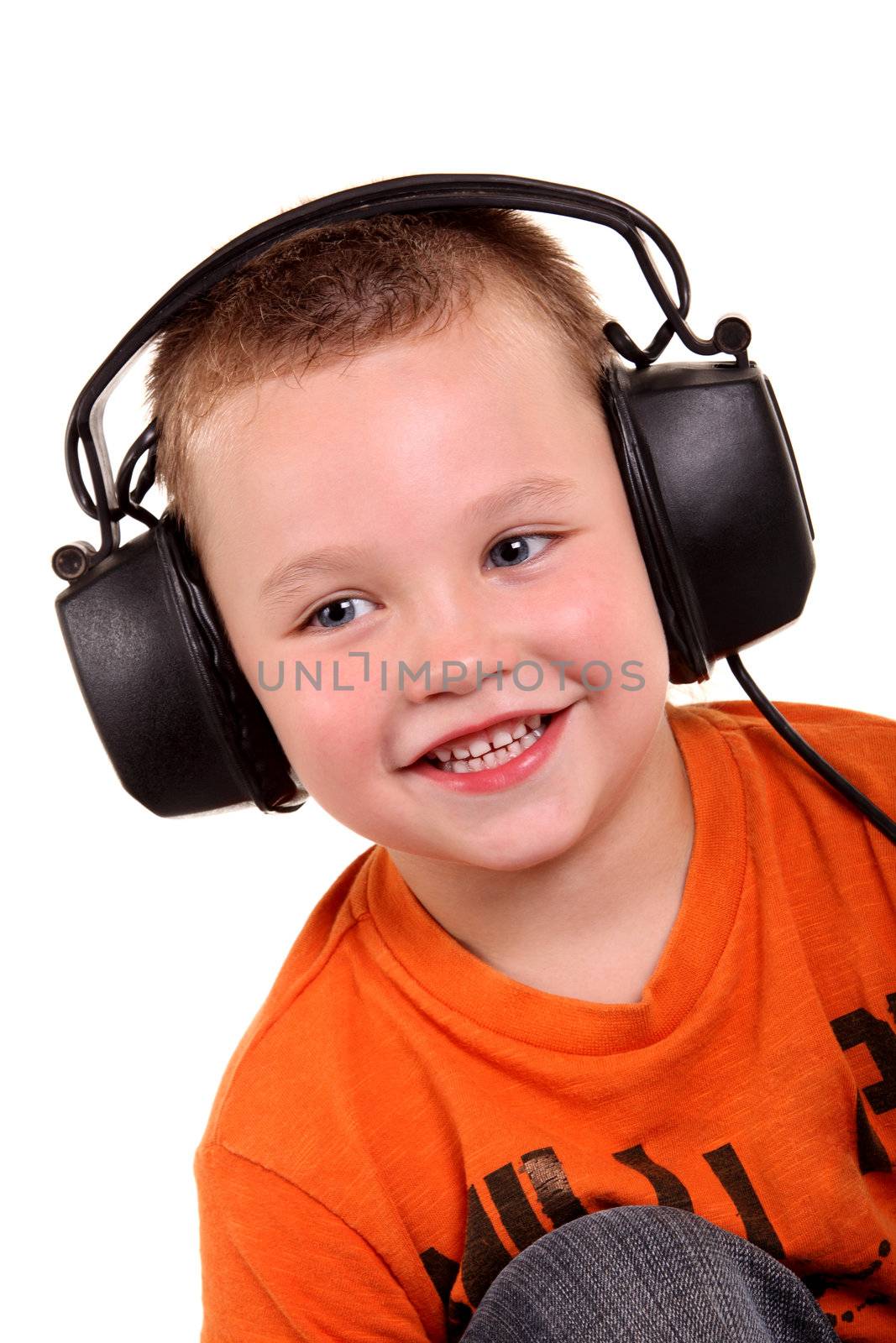 Little boy in headphones on the white background
