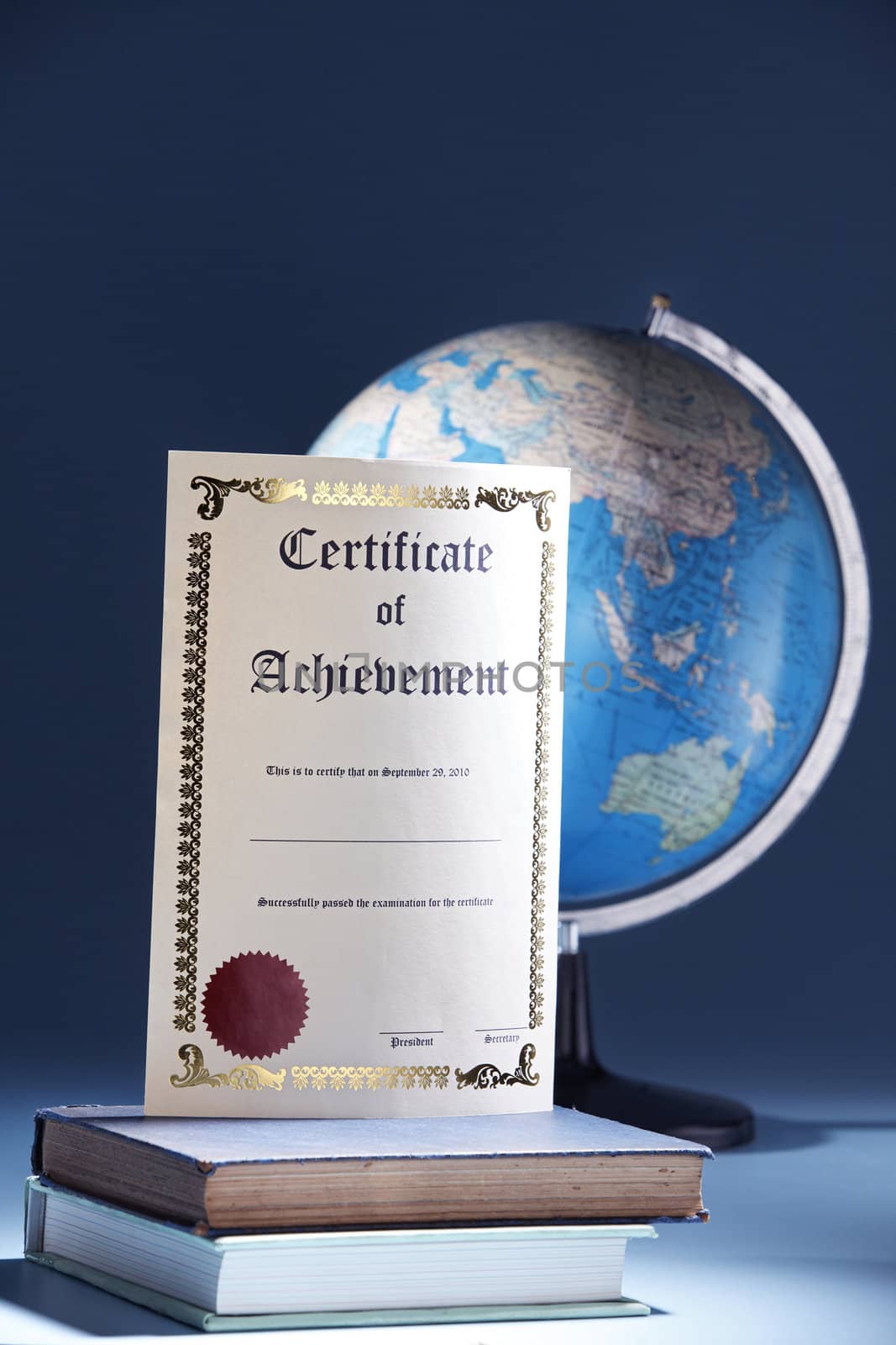 education concept with certificate and globe