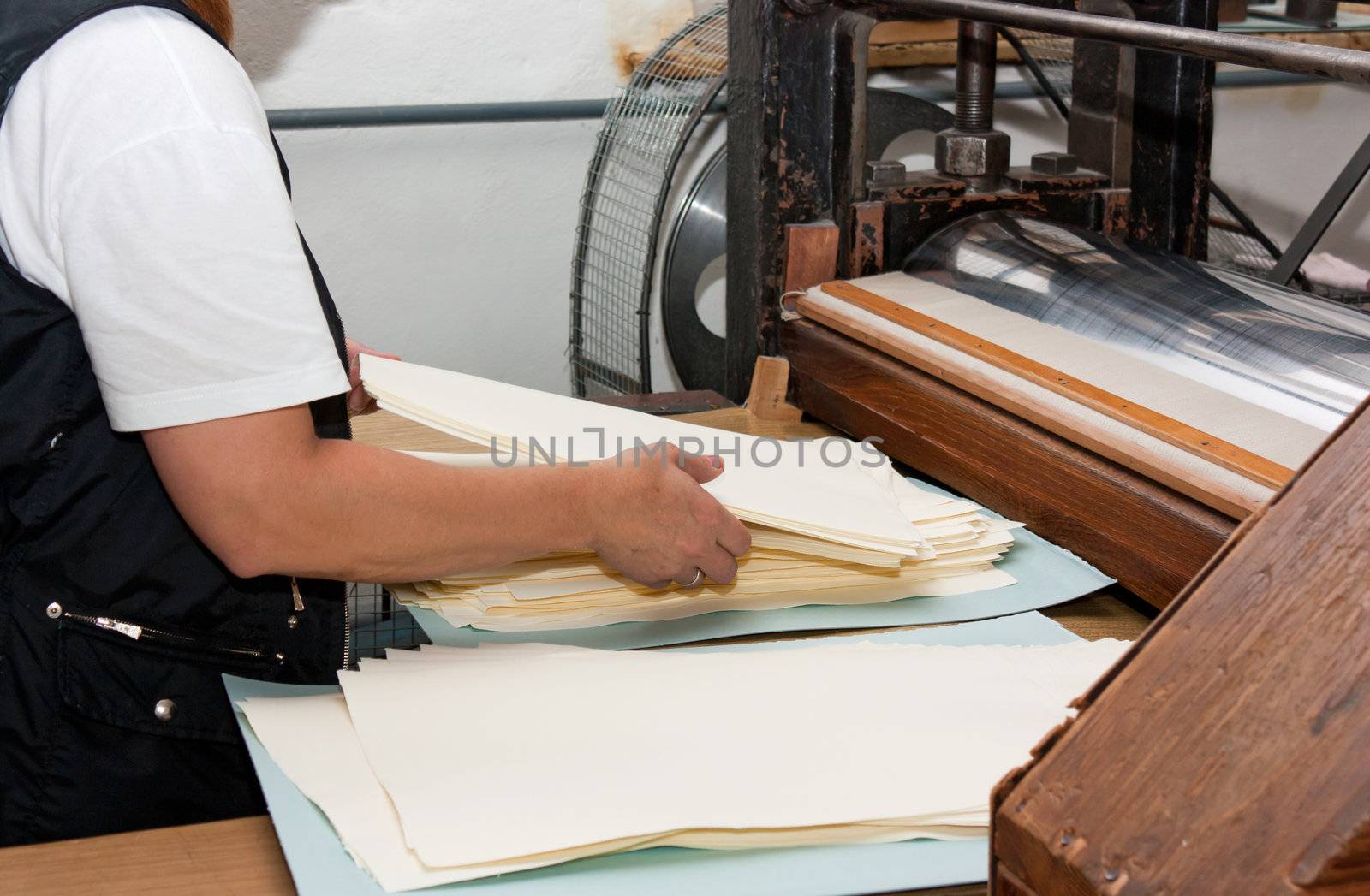 Woman making paper  in the traditional way