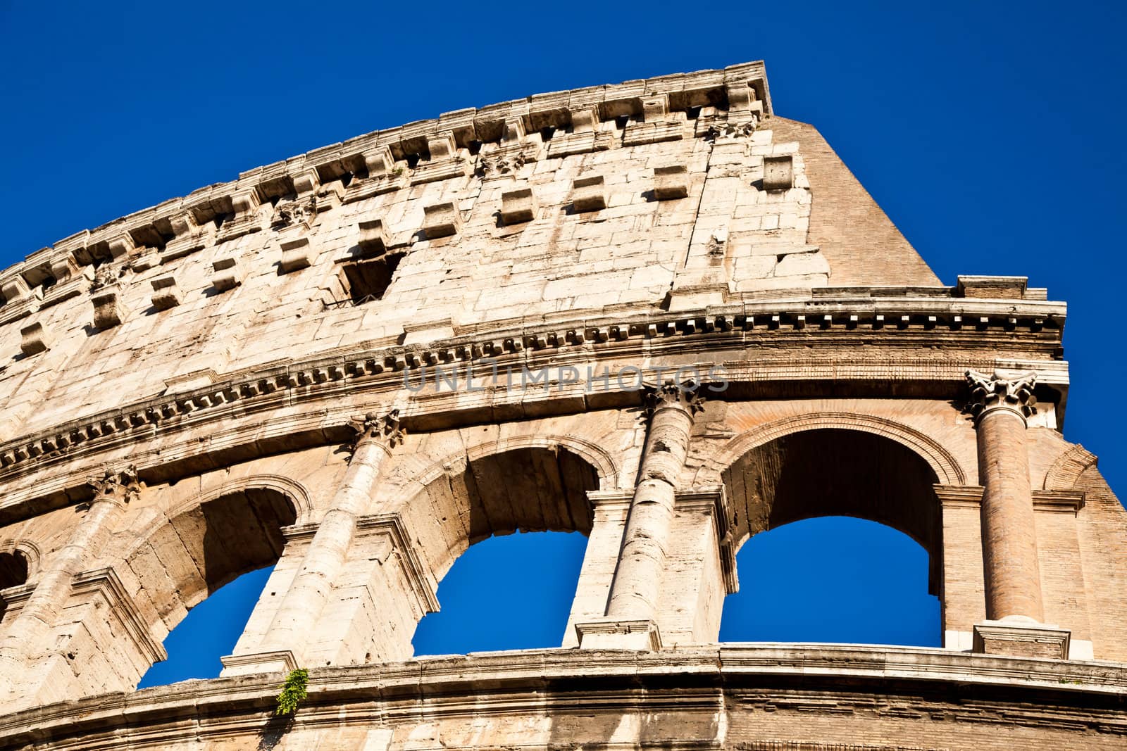 Colosseum in Rome with blue sky, landmark of the city