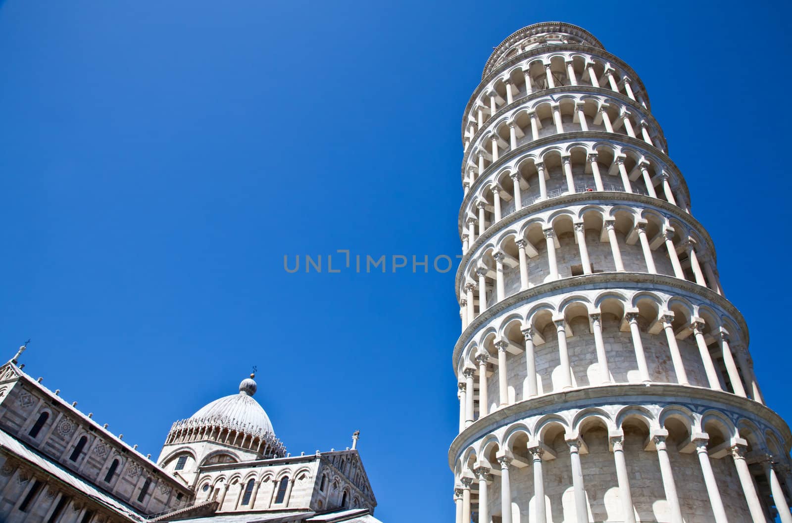Italy - Pisa. The famous leaning tower on a perfect blue bakcground
