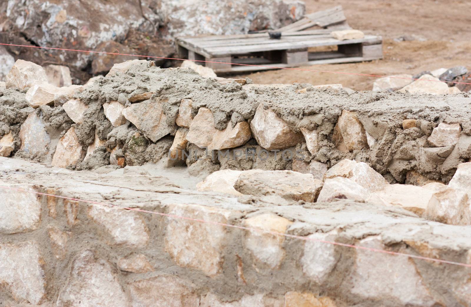 Step construction of a thick stone wall