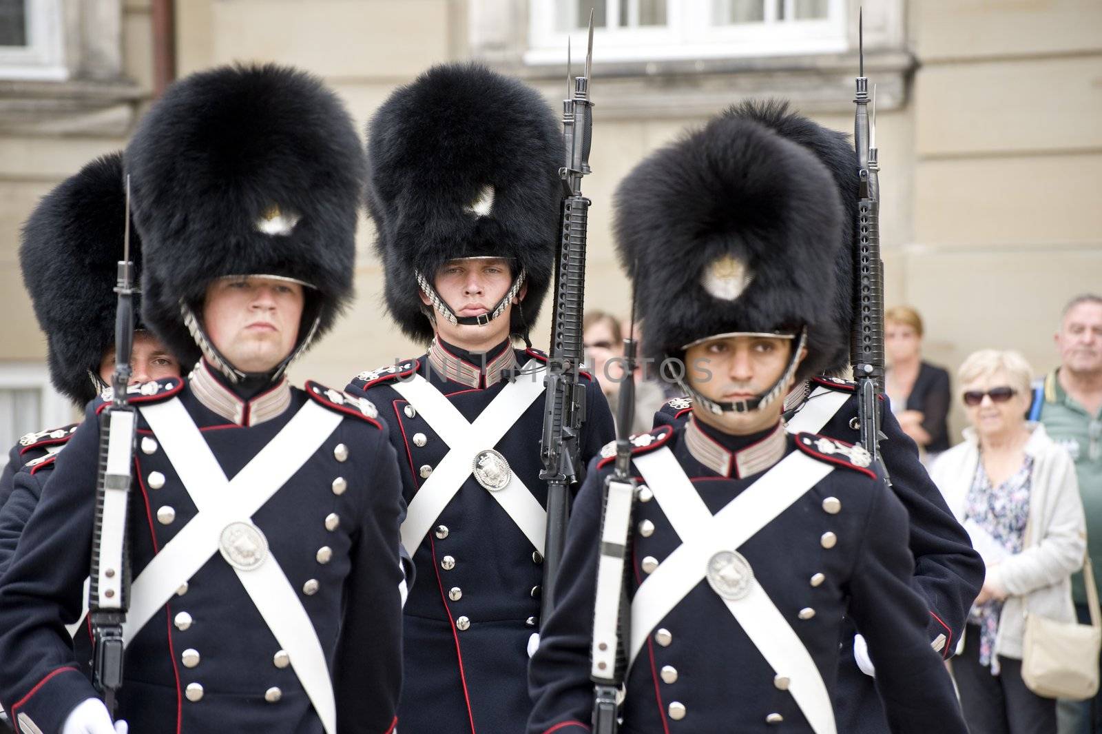 The Royal Danish Guard patrols the royal residence Amalienborg Palace and serves the royal Danish family. Amalienborg is also known for the Danish Royal Guard, who patrol the palace grounds. The Danish Royal Guard march from Rosenborg Castle at 11.30am daily through the streets of Copenhagen, and execute the changing of the guard in front of Amalienborg Palace at noon. When the Queen is in reside