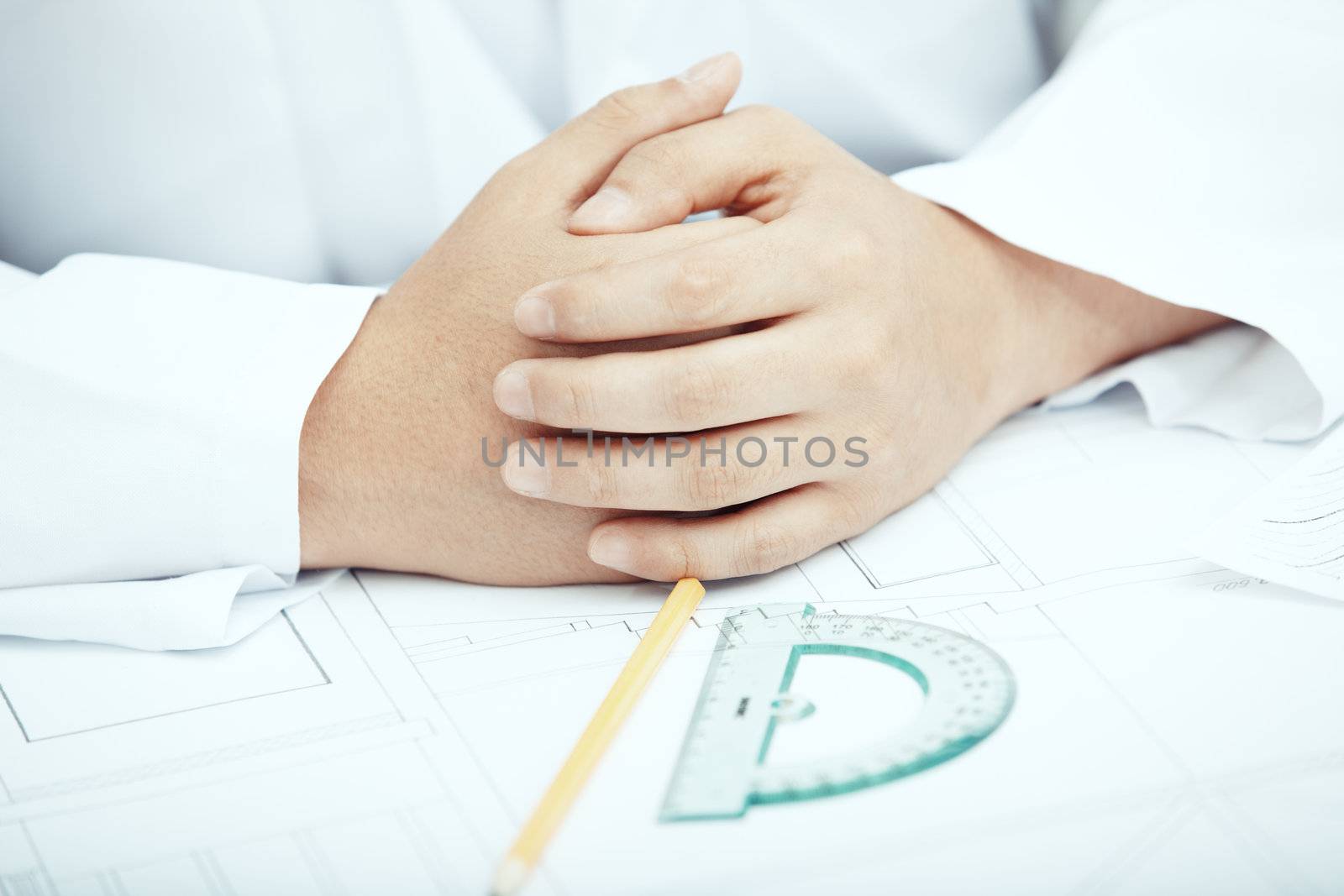 Hands of engineer working with drawing project