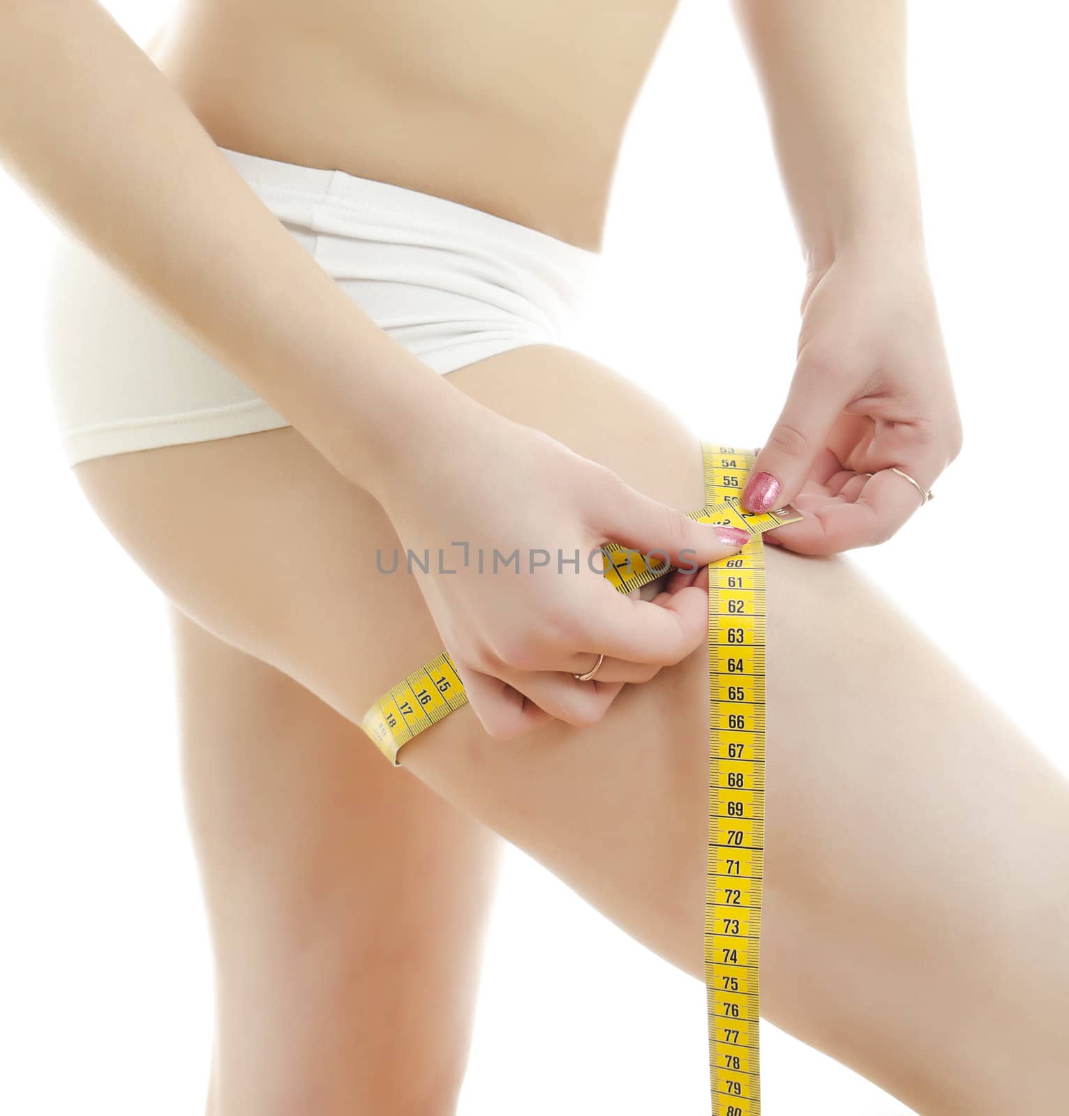 Woman measuring her leg. Isolated on white background