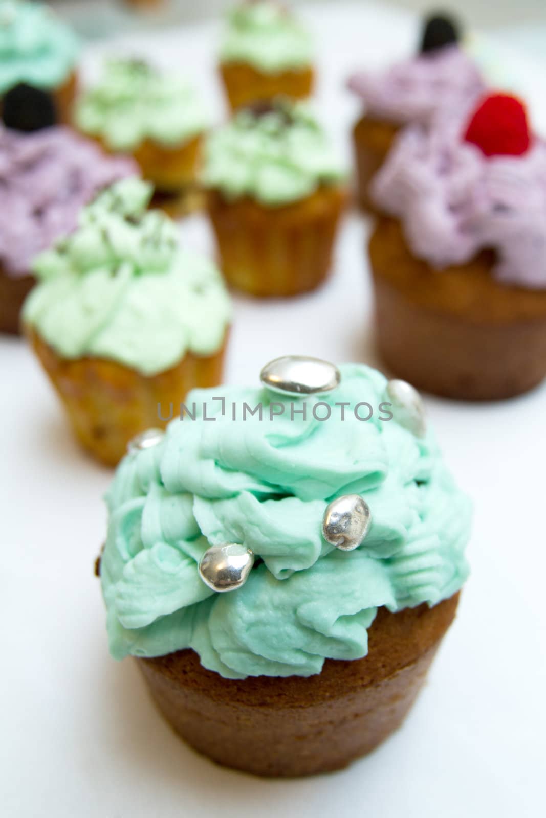 Cupcakes on white background by chrisroll