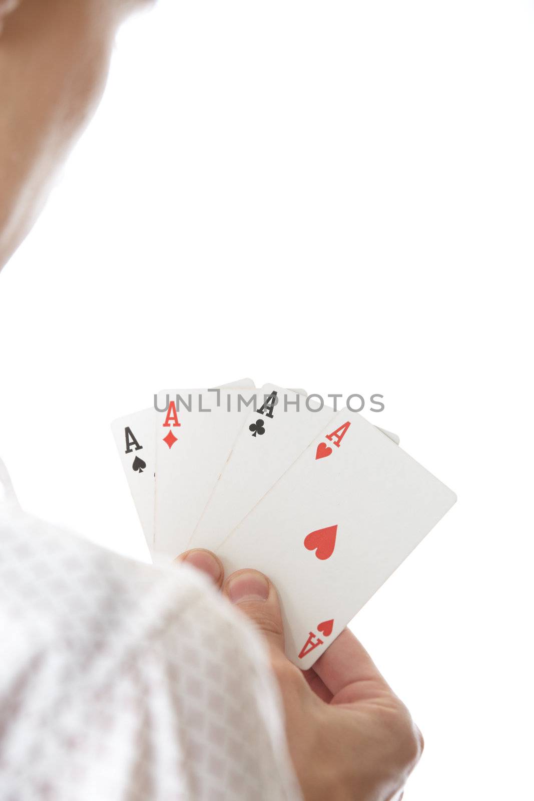 Man holding cards with Four of Aces. Rear view on a white background. Focus is on cards