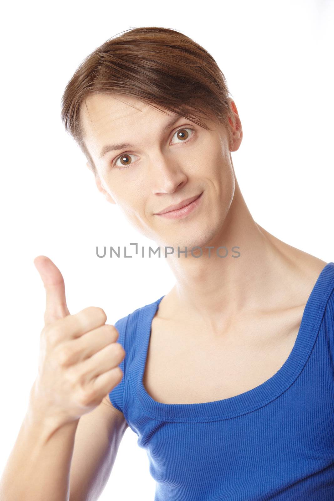 Young fitness instructor making thumbs up gesture on a white background