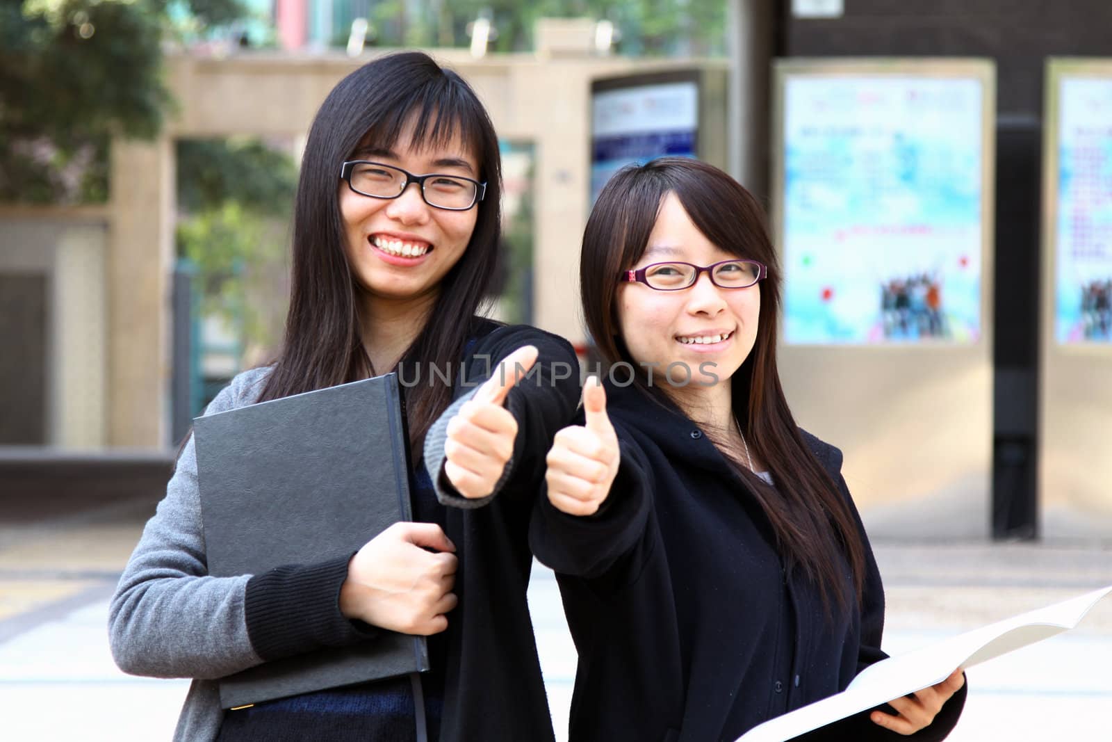 Asian woman with thumb up