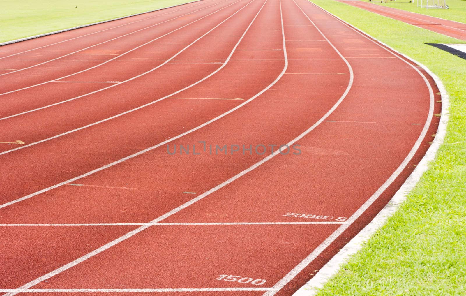 a close up of white line on red racetrack, for sports, concept background.