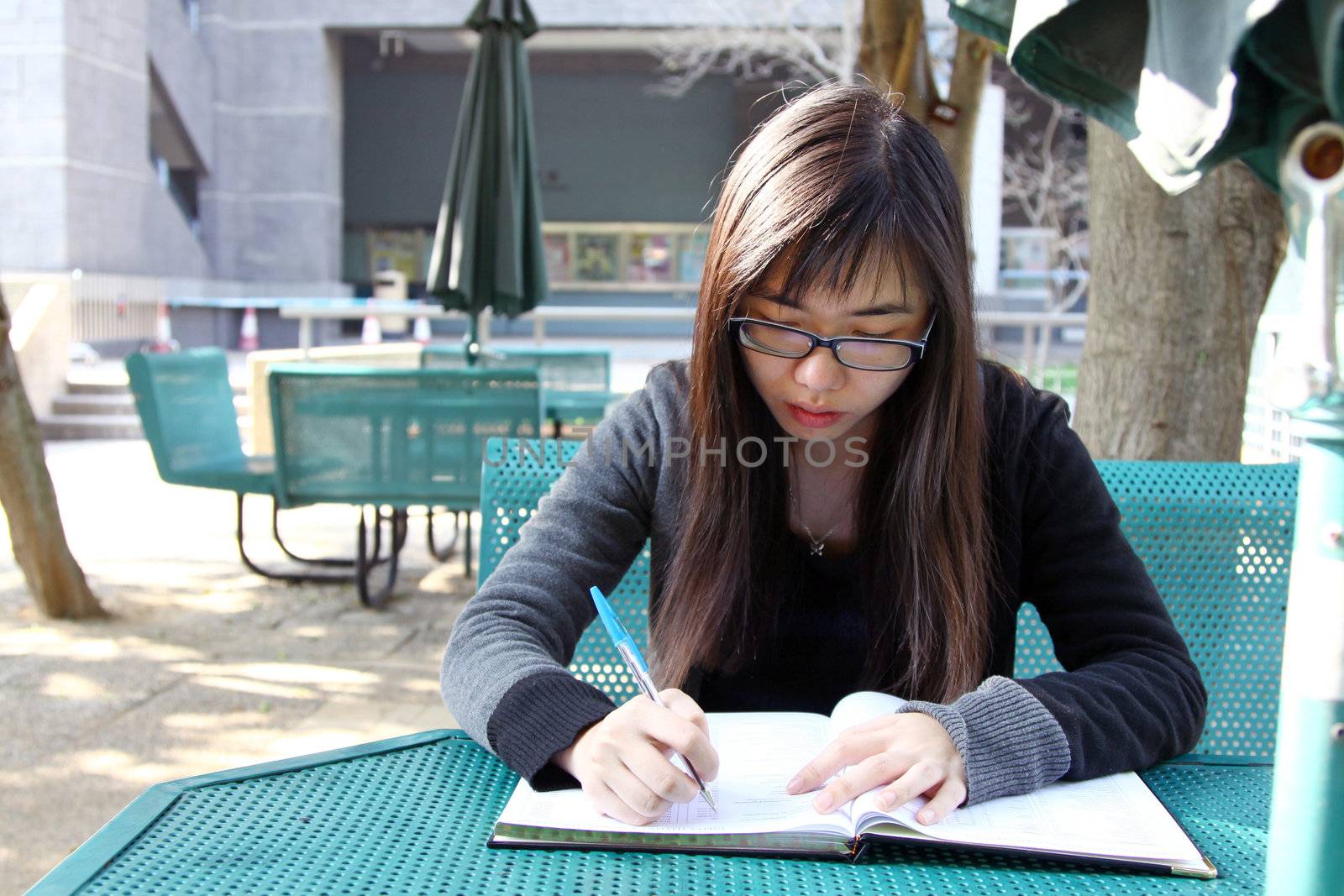 Asian girl studying in university by kawing921