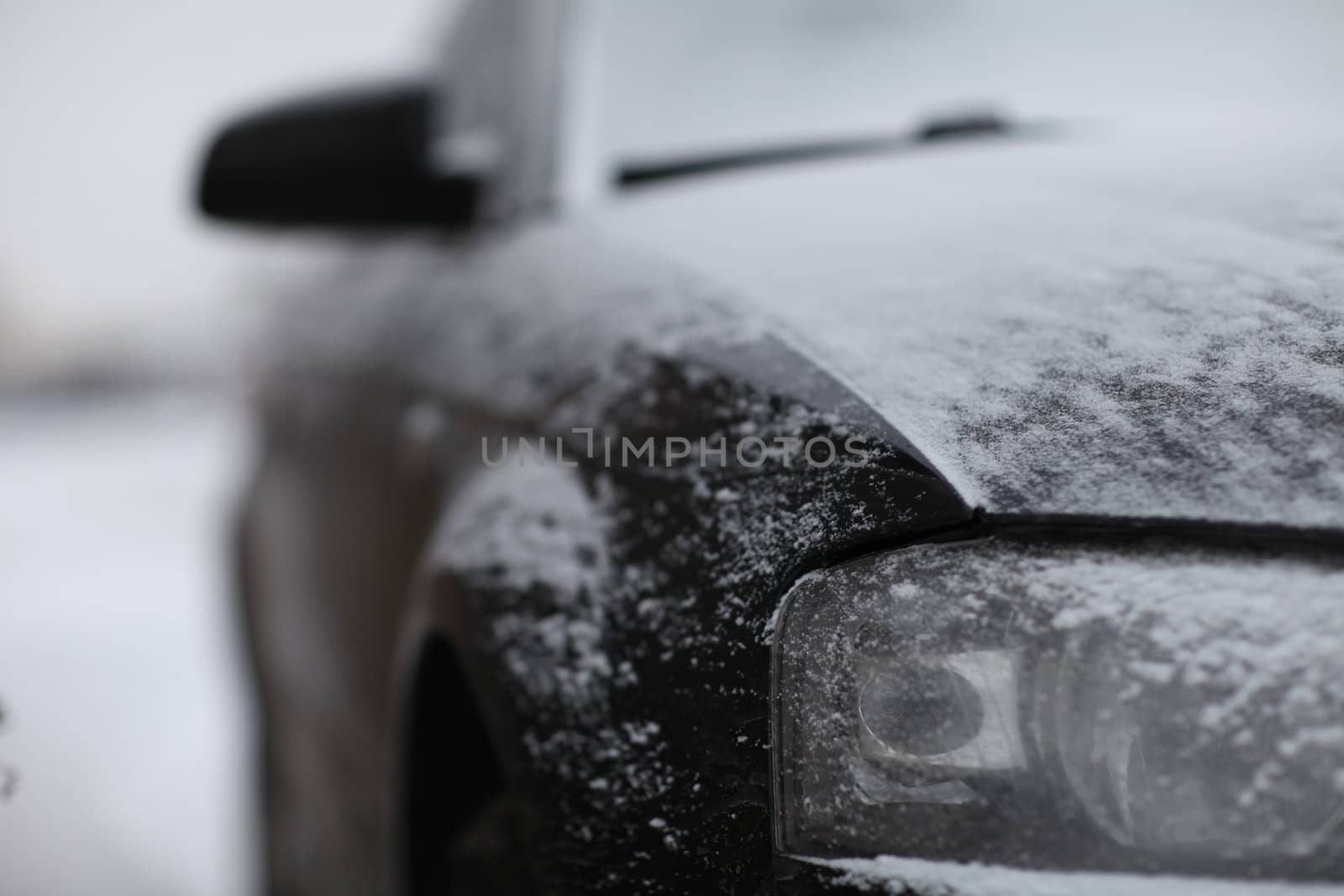 fragment of the car, front view, snow ice freezing speed
