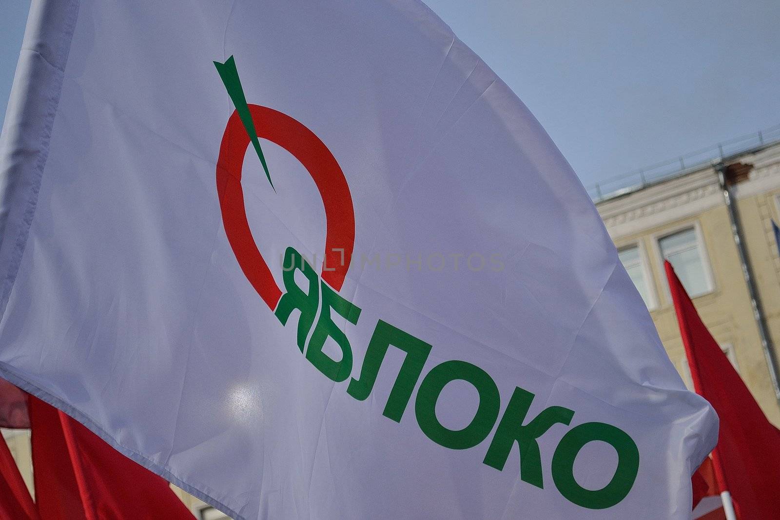 Waving flag of Russian Democratic Party on the Bolotnaya Square in time of processing against fair elections