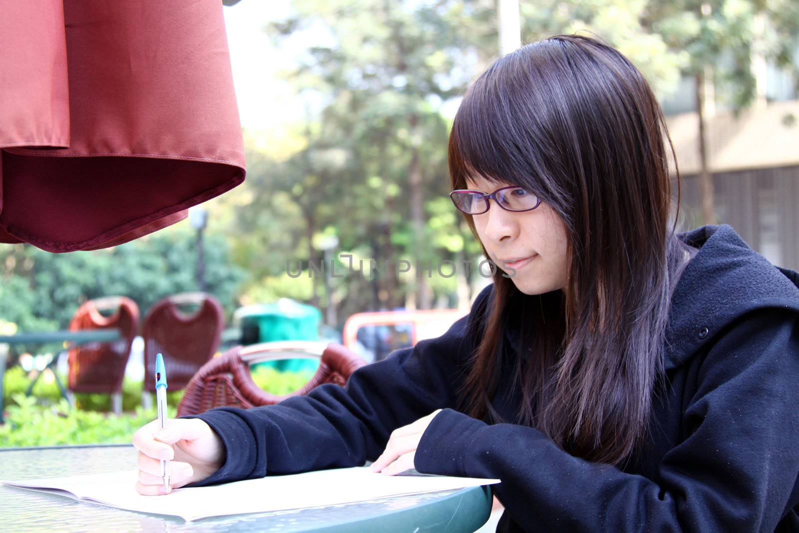 Asian girl studying in university by kawing921