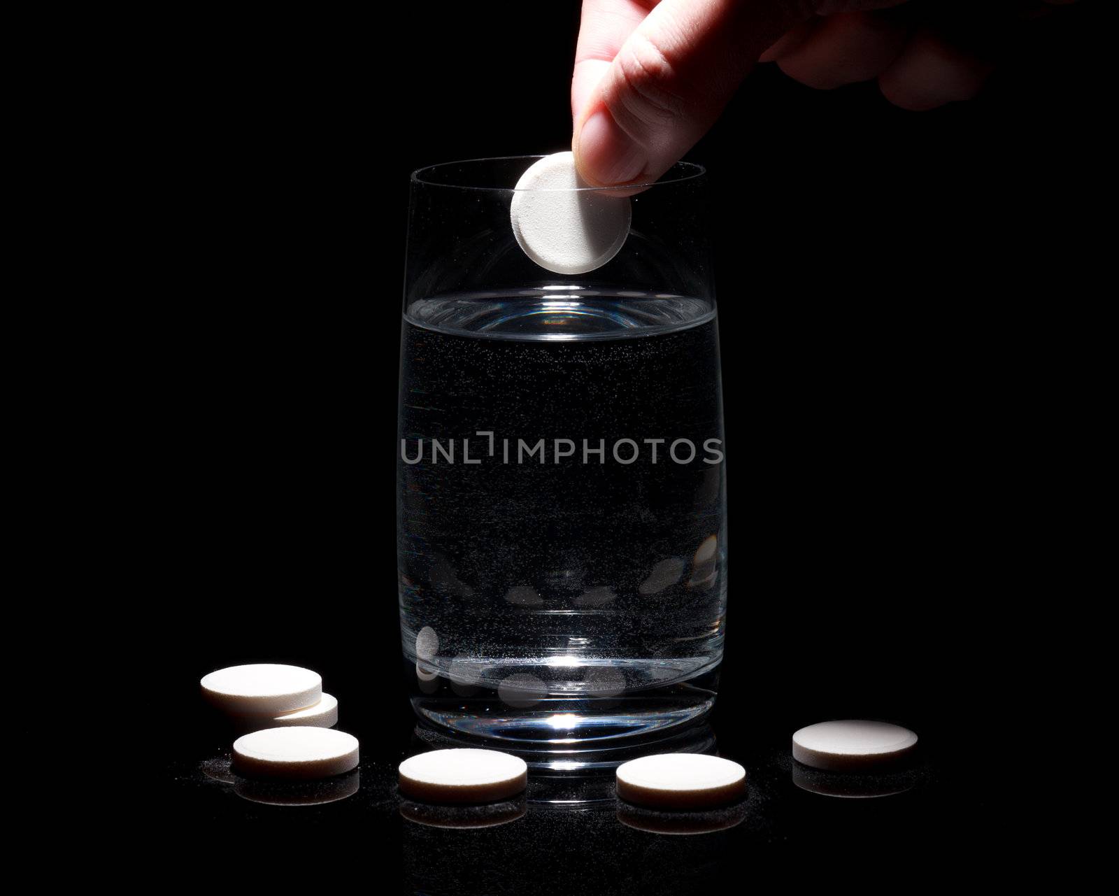 Painkiller tablet in hand  by Discovod