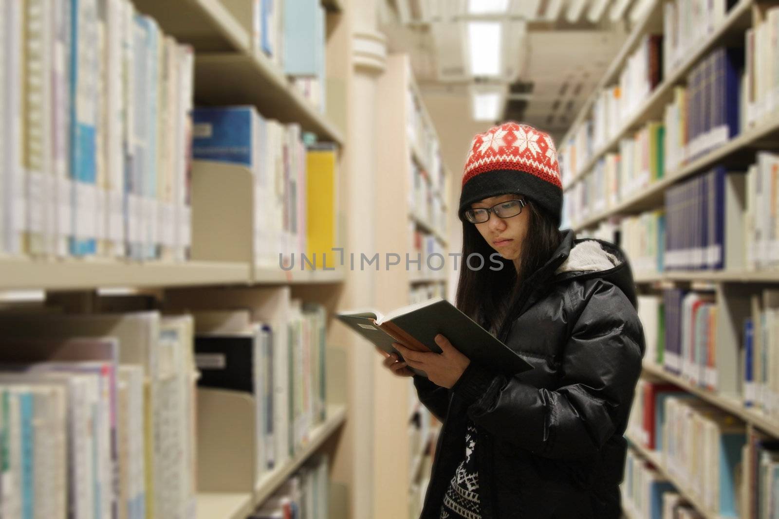 Asian woman studying in library