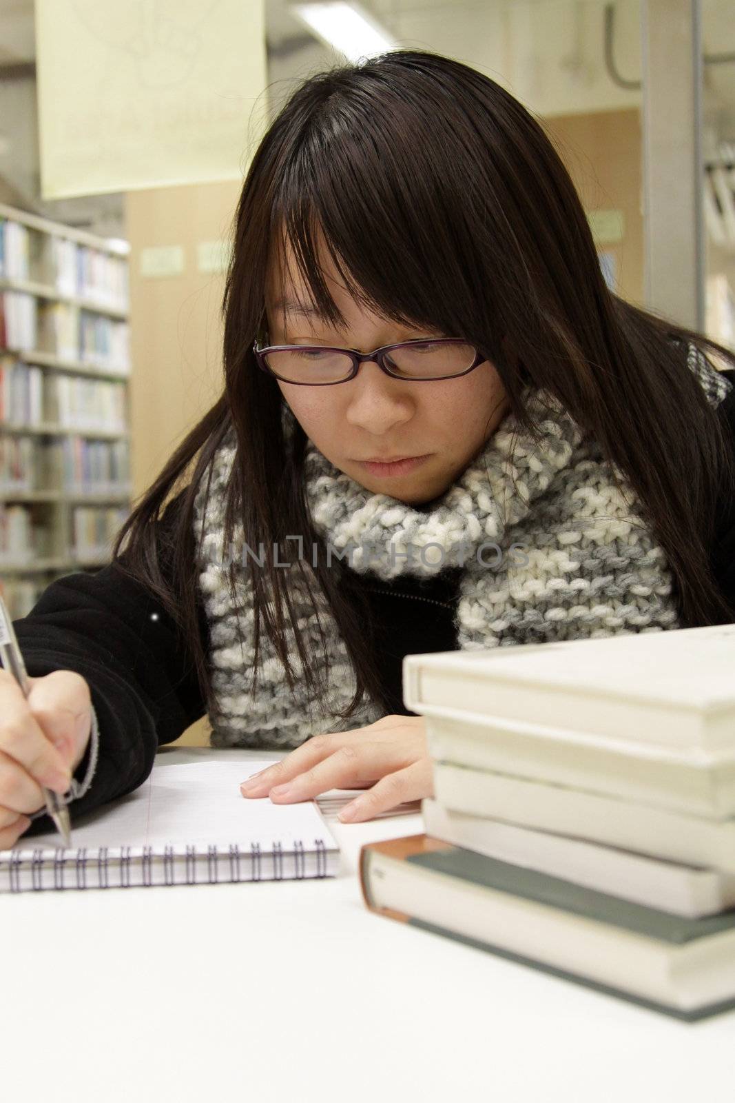 Asian university student in library by kawing921