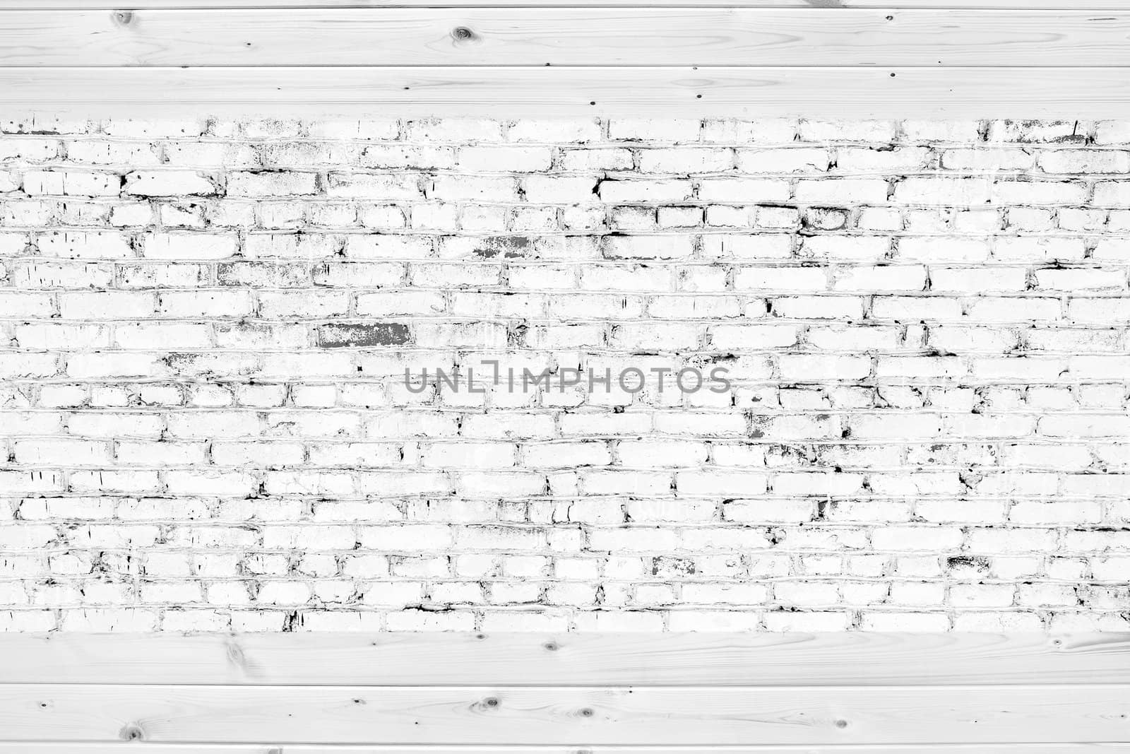 Old brick wall with white bricks and wood planks