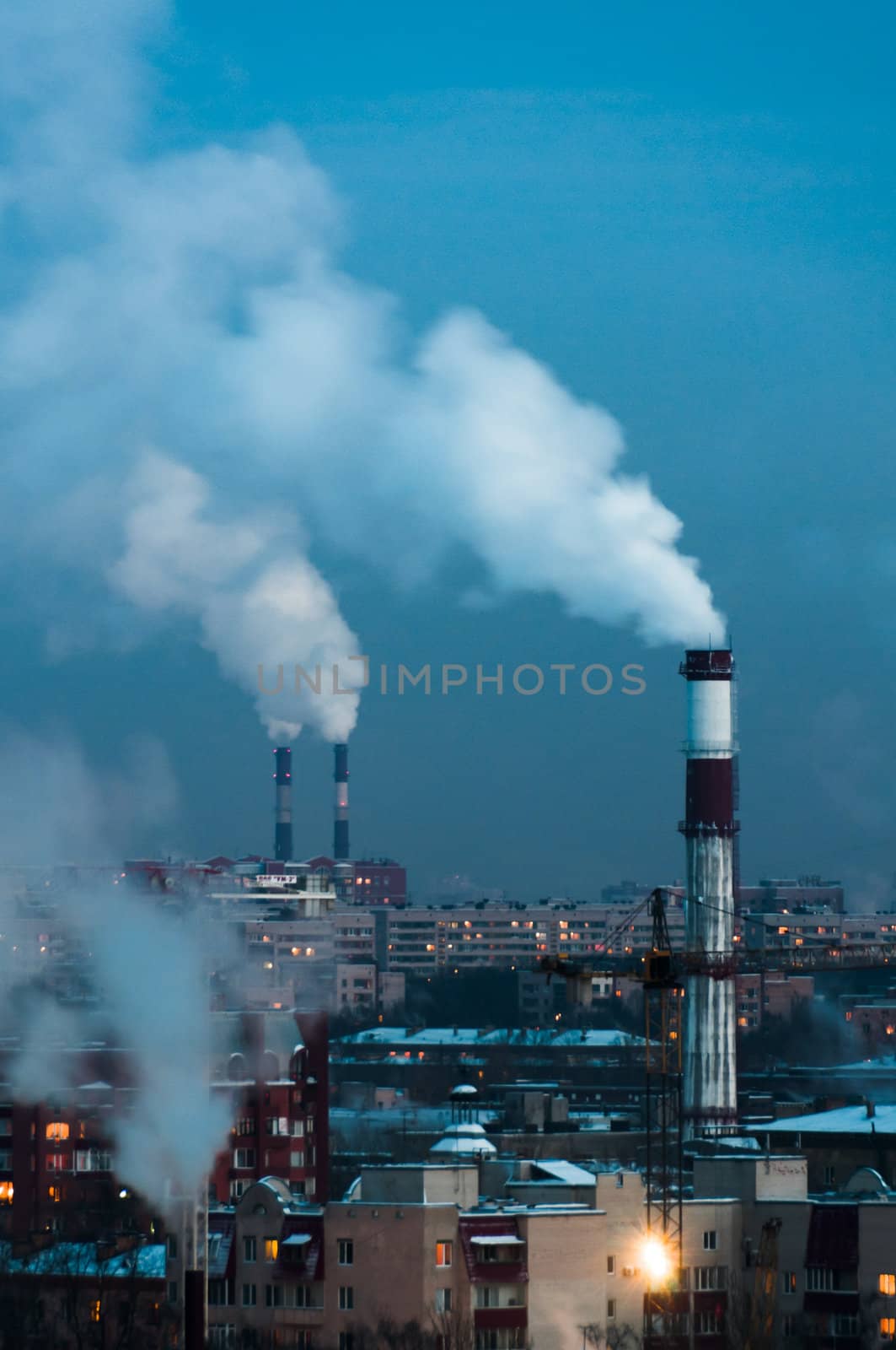 Giant pipes in city center make smoke, Saint-Petersburg, Russia