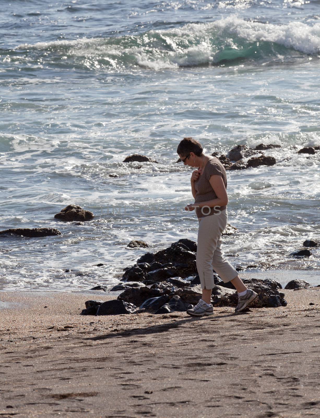 Woman beachcomb on Glass Beach by steheap