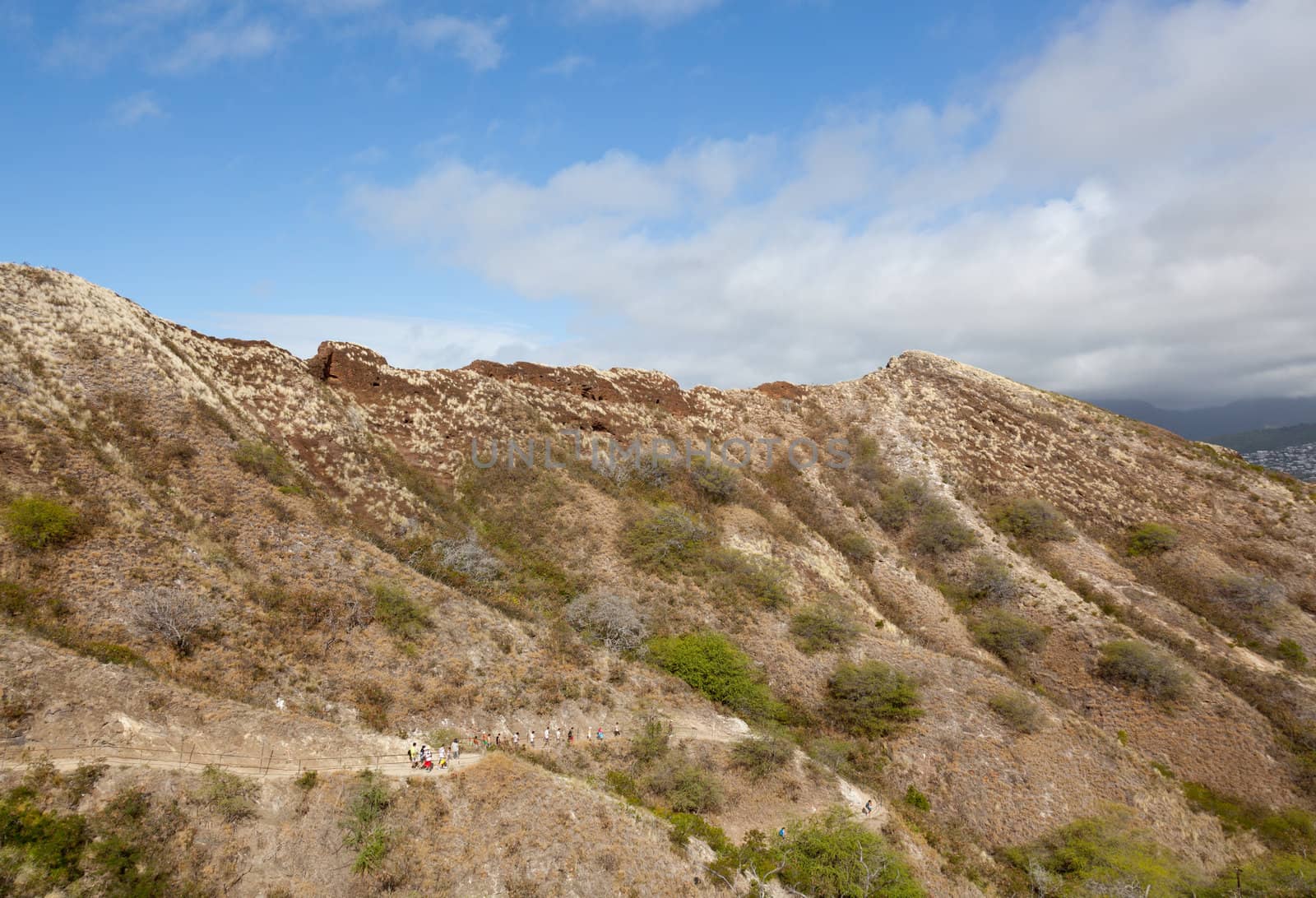 Waikiki, HI - JANUARY 15: Tourists climbing to summit of Diamond Head crater on January 15, 2012. The path gains 560 feet from the crater floor.
