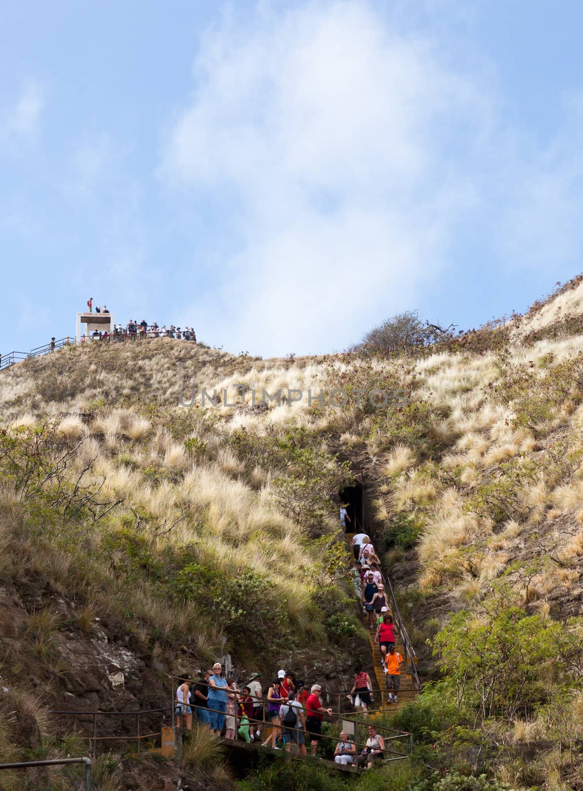 Waikiki, HI - JANUARY 15: Tourists climbing to summit of Diamond Head crater on January 15, 2012. The path gains 560 feet from the crater floor.
