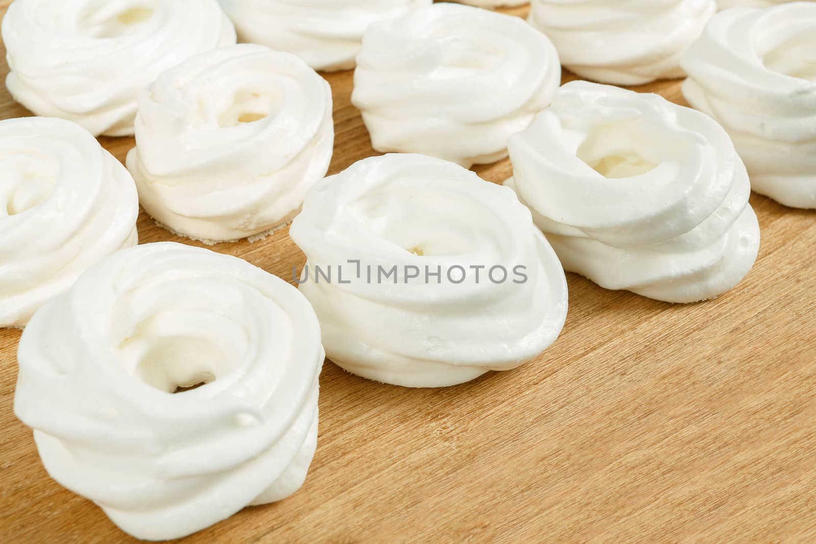 close up of homemade white very sweet baked, candy on wooden background