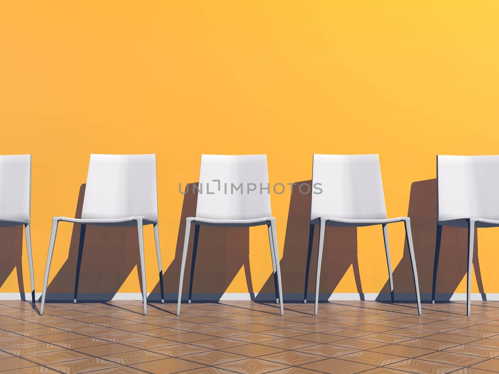 Several white chairs against the wall in a waiting room