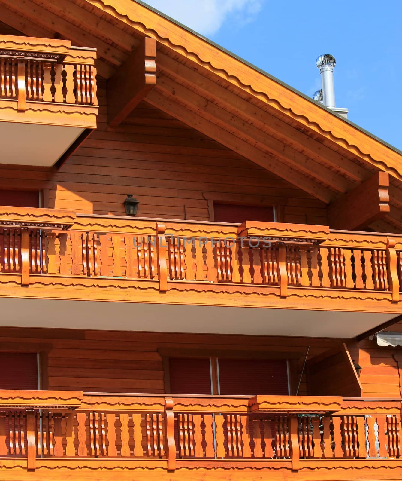 Close up of a brown wooden chalet by beautiful day, Crans Montana, Switzerland