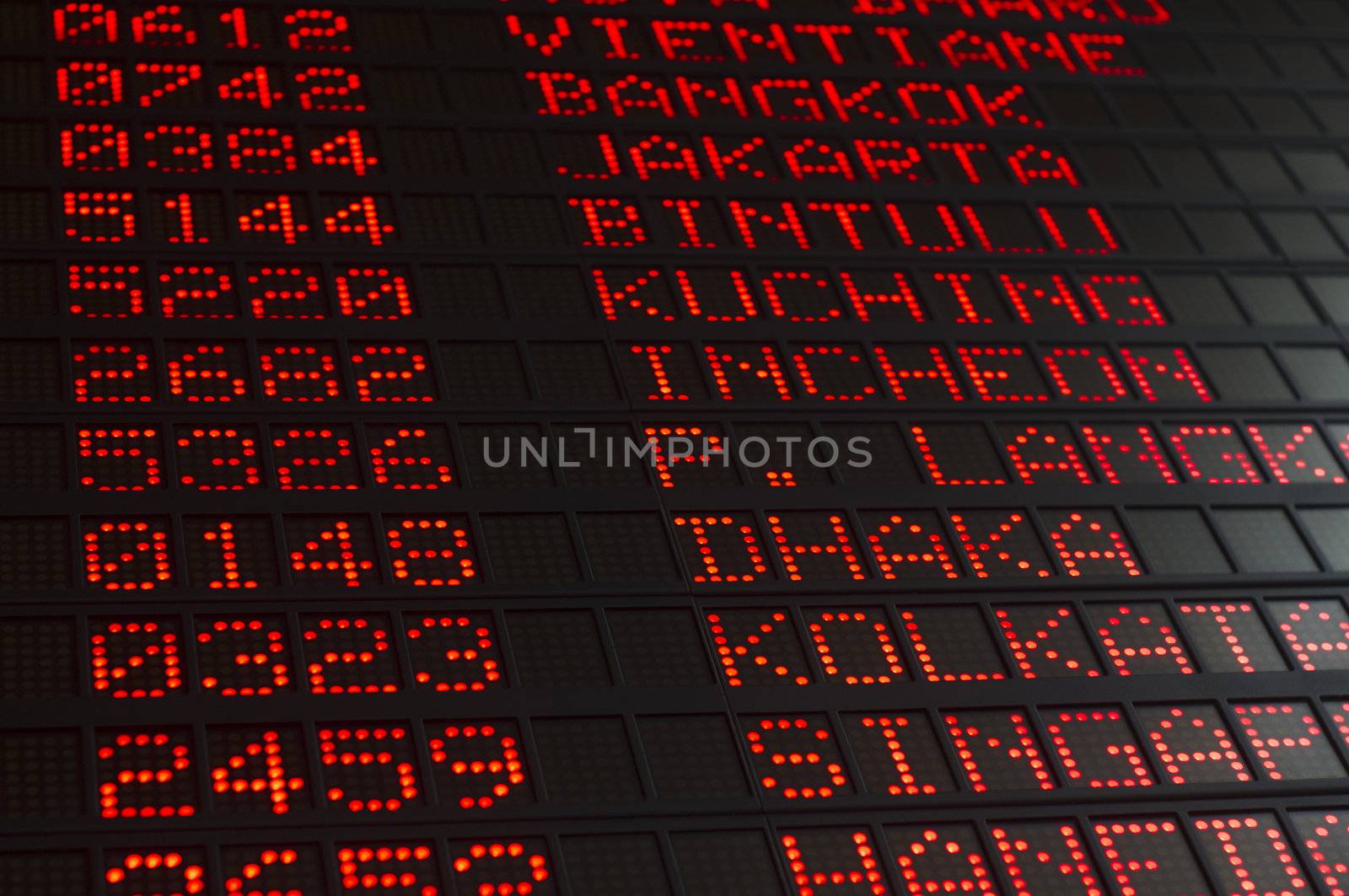 airport departures board that shows asian destinations.