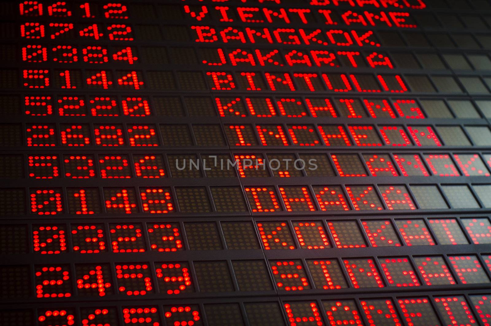 airport departures board that shows asian destinations.