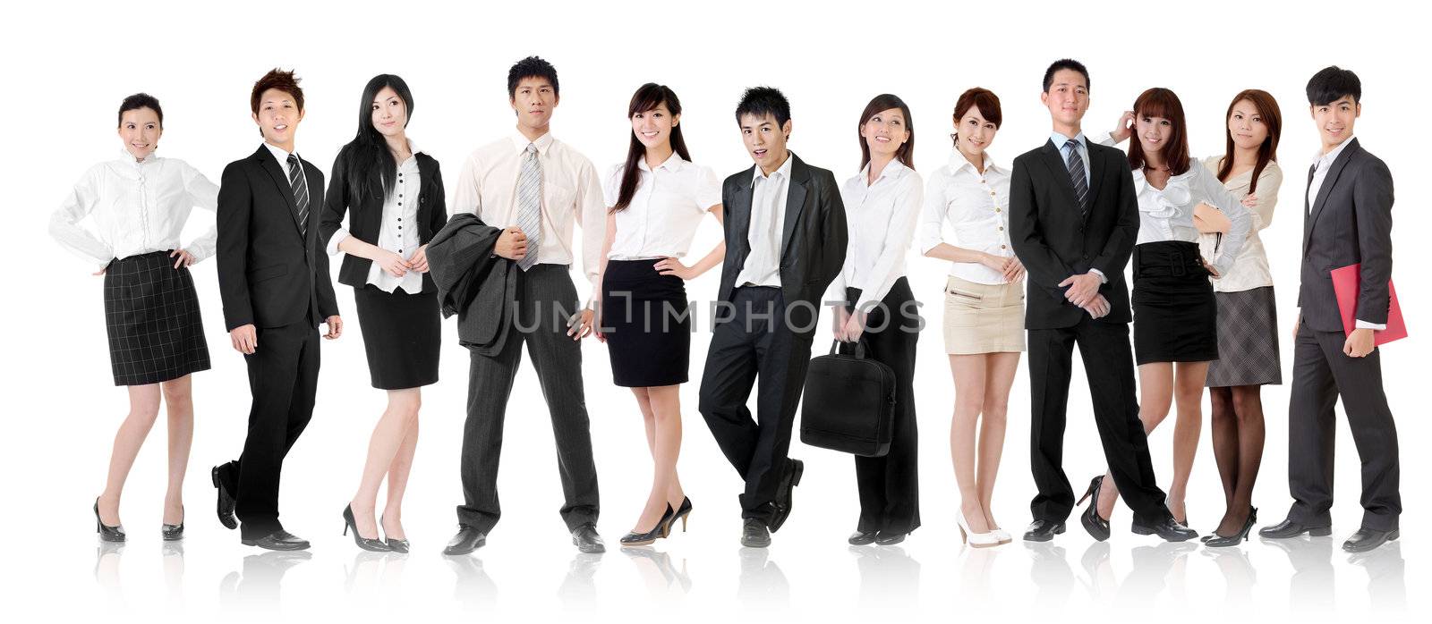 Asian business team, businesswoman and businessman in group standing and looking at you, isolated on white background.