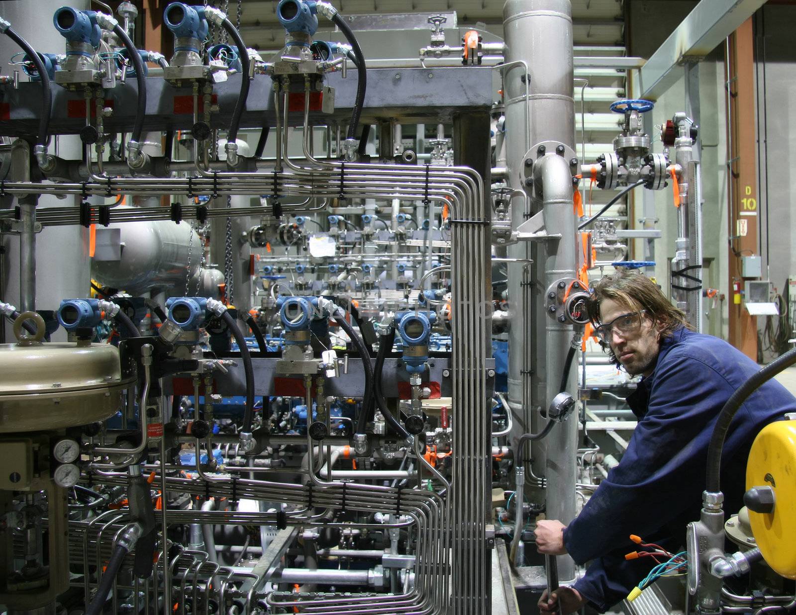 Technician working on a complex machinery