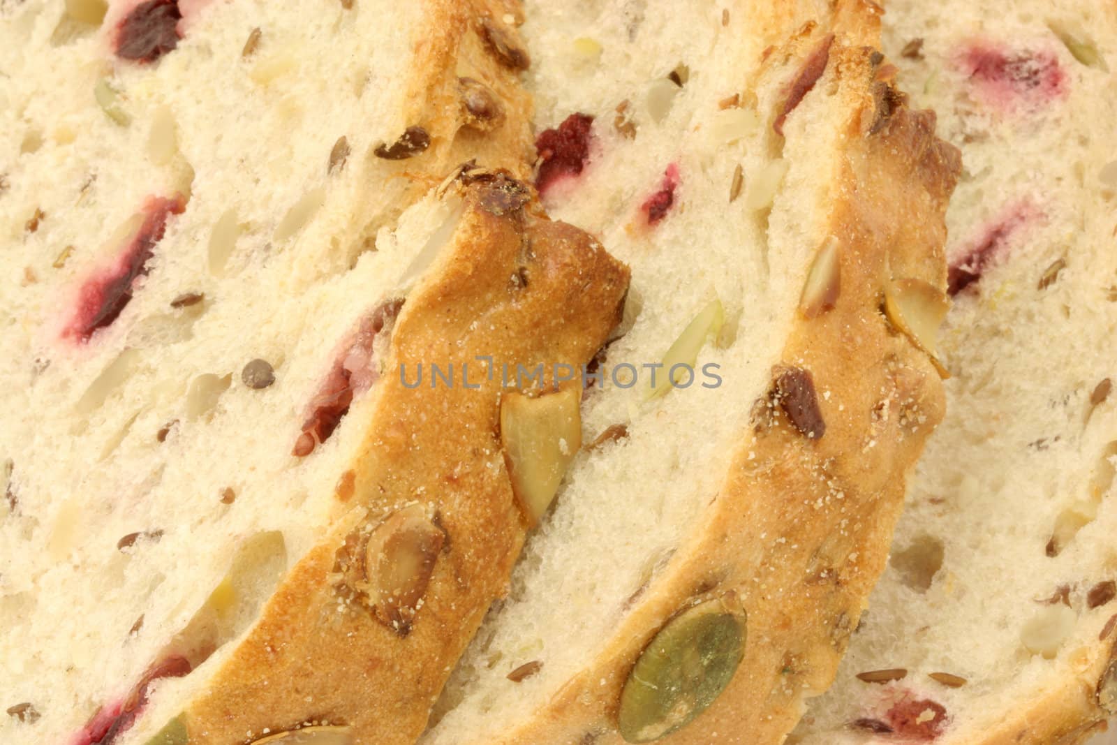 Macro of cranberry and pumpkin seed bread slices