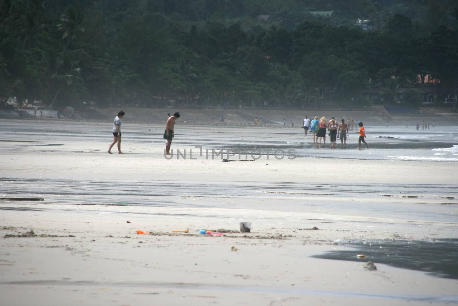 tourists walking on the beach on white sand beach koh chang island thailand