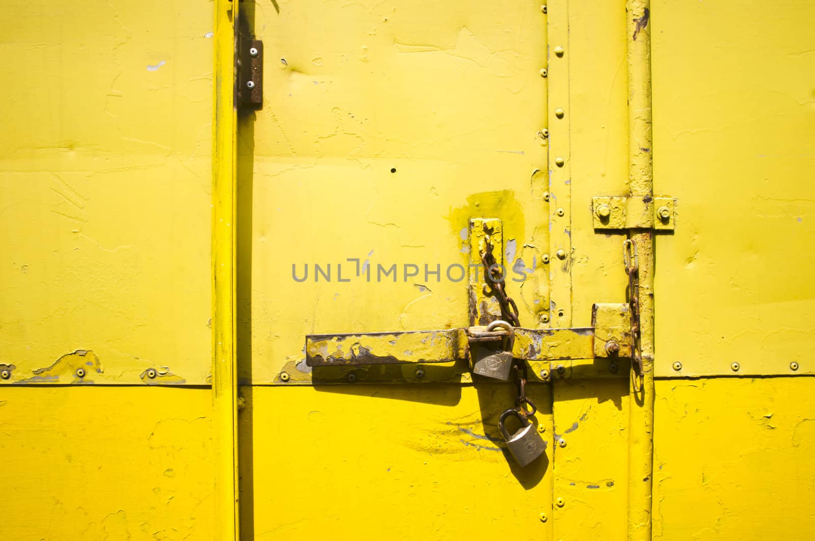 yellow metal door latch and lock, for conceptual background.