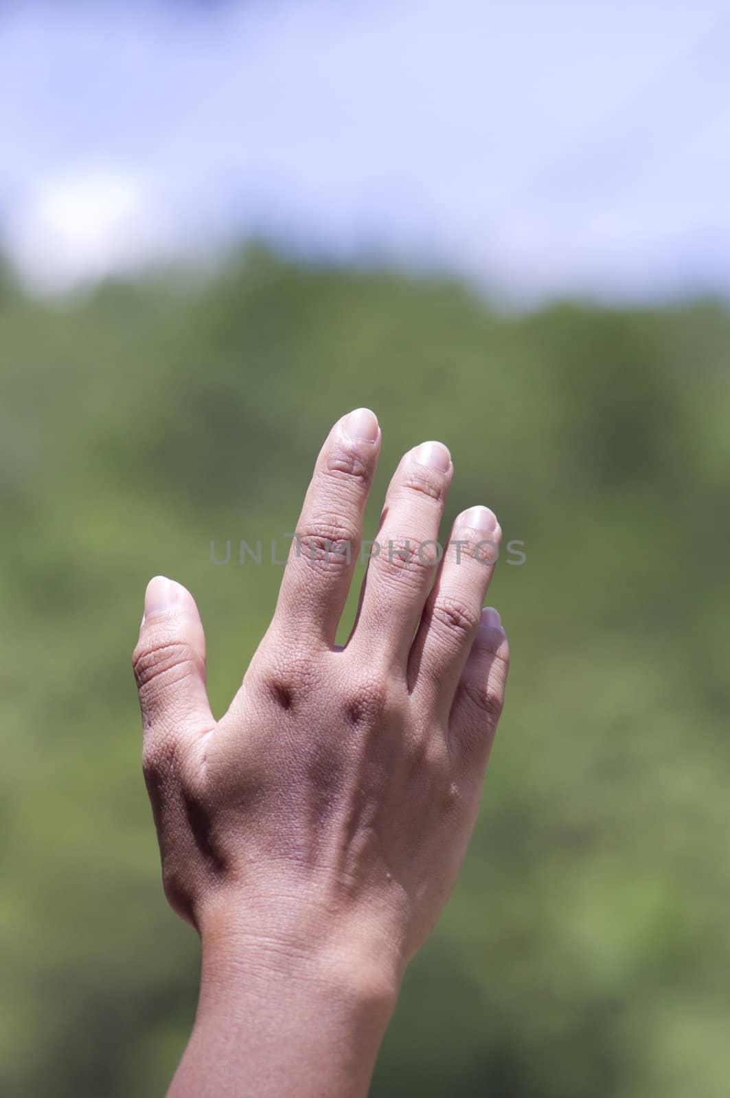 hand reaching out in air, at natures outdoors