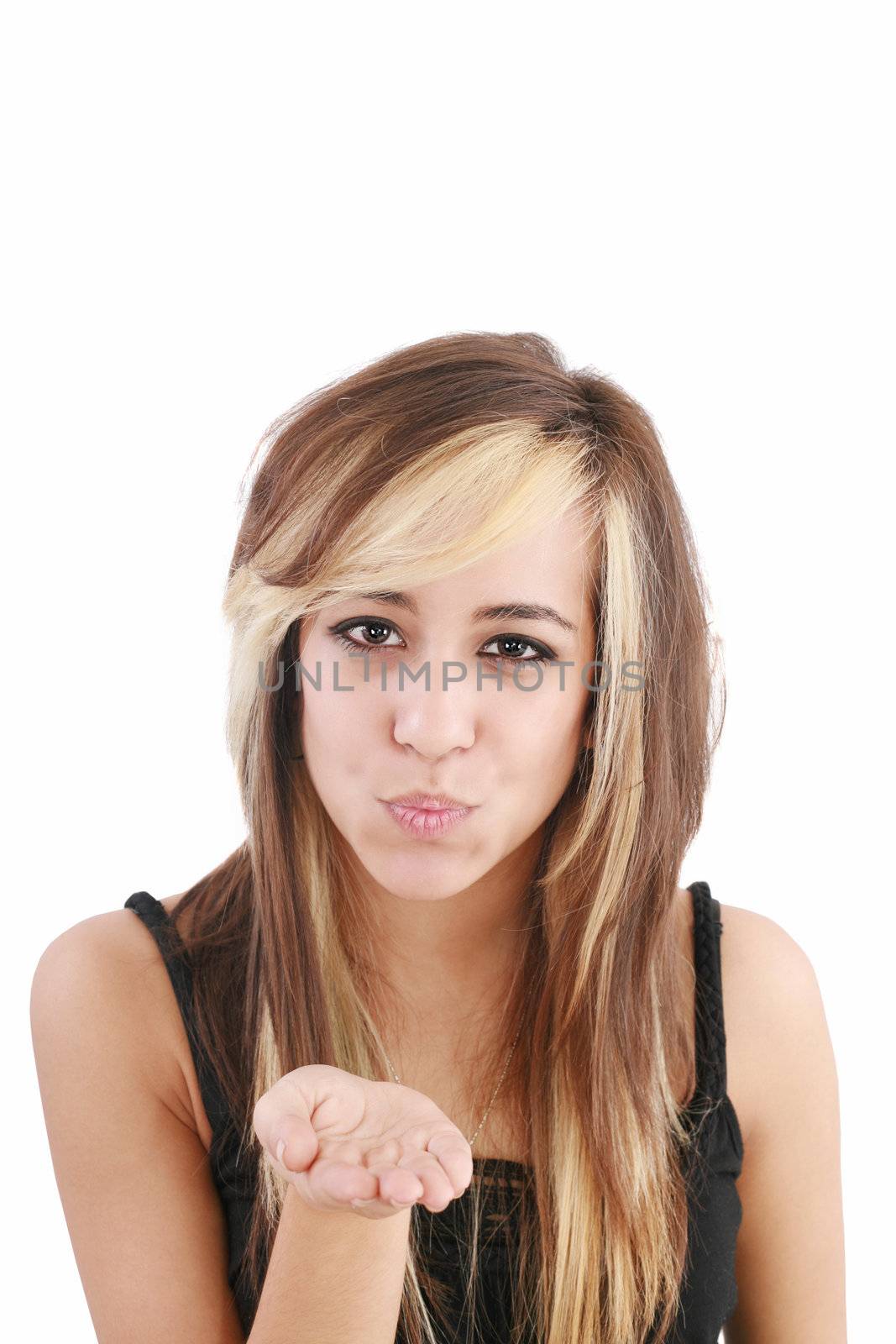 Portrait of a woman blowing a kiss against a white background