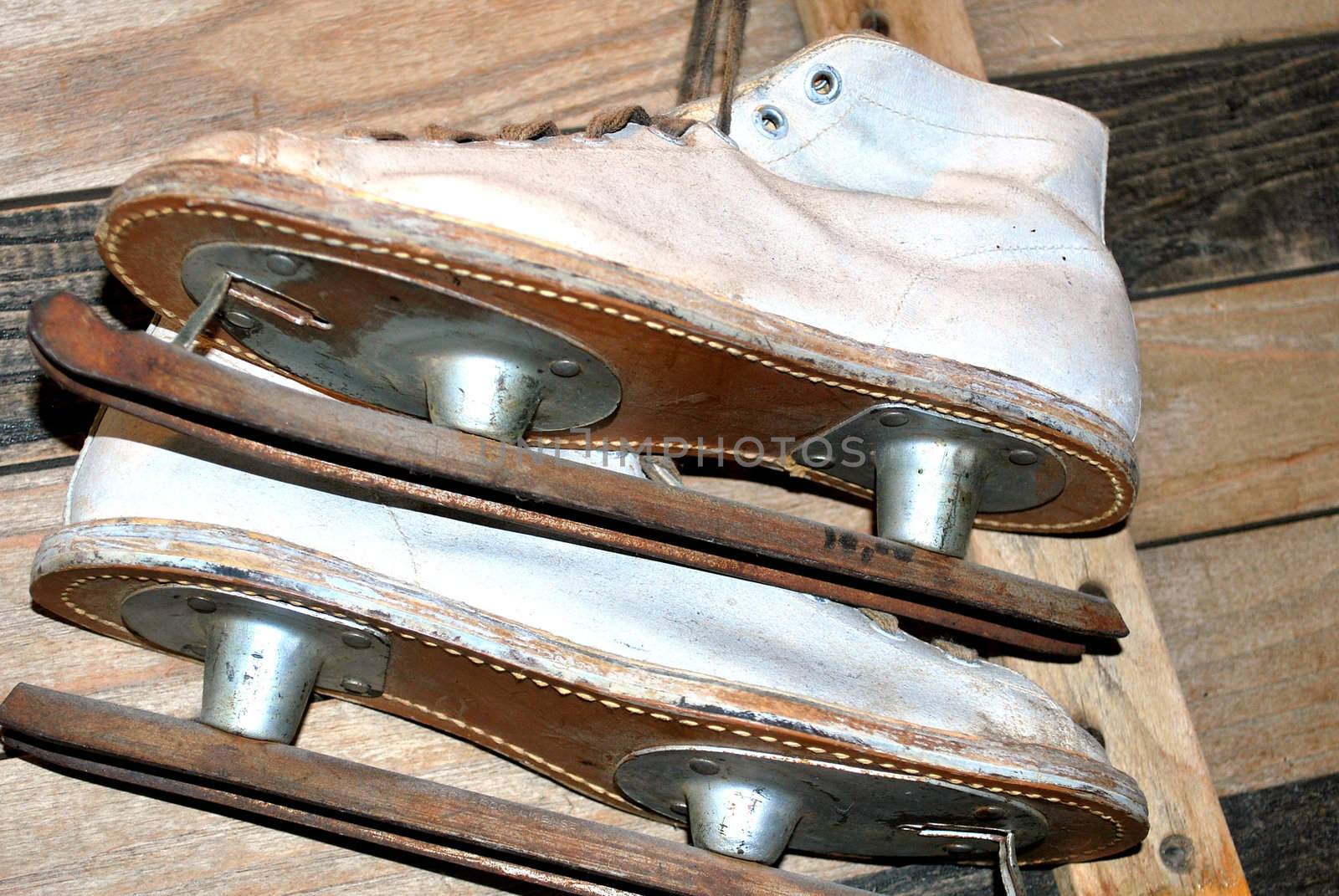 Vintage ice skating boots on display.