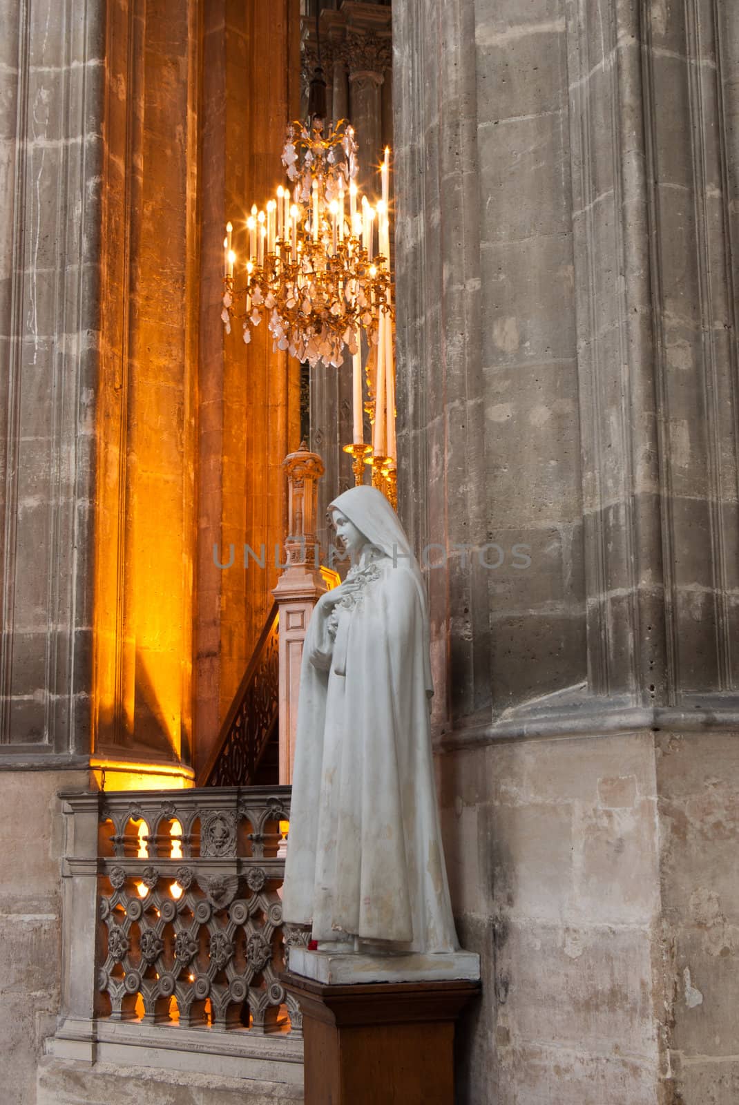 Old statue of Virgin Mary inside the Church in Paris, France