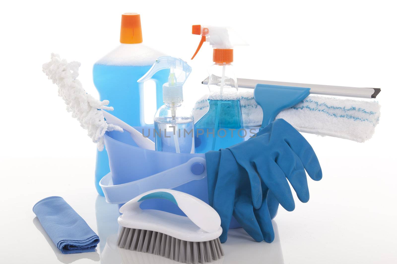 Plastic bucket with cleaning supplies on white background