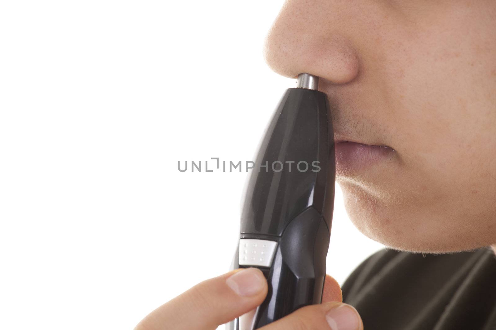 Close up man portrait with trimmer near his nose by senkaya