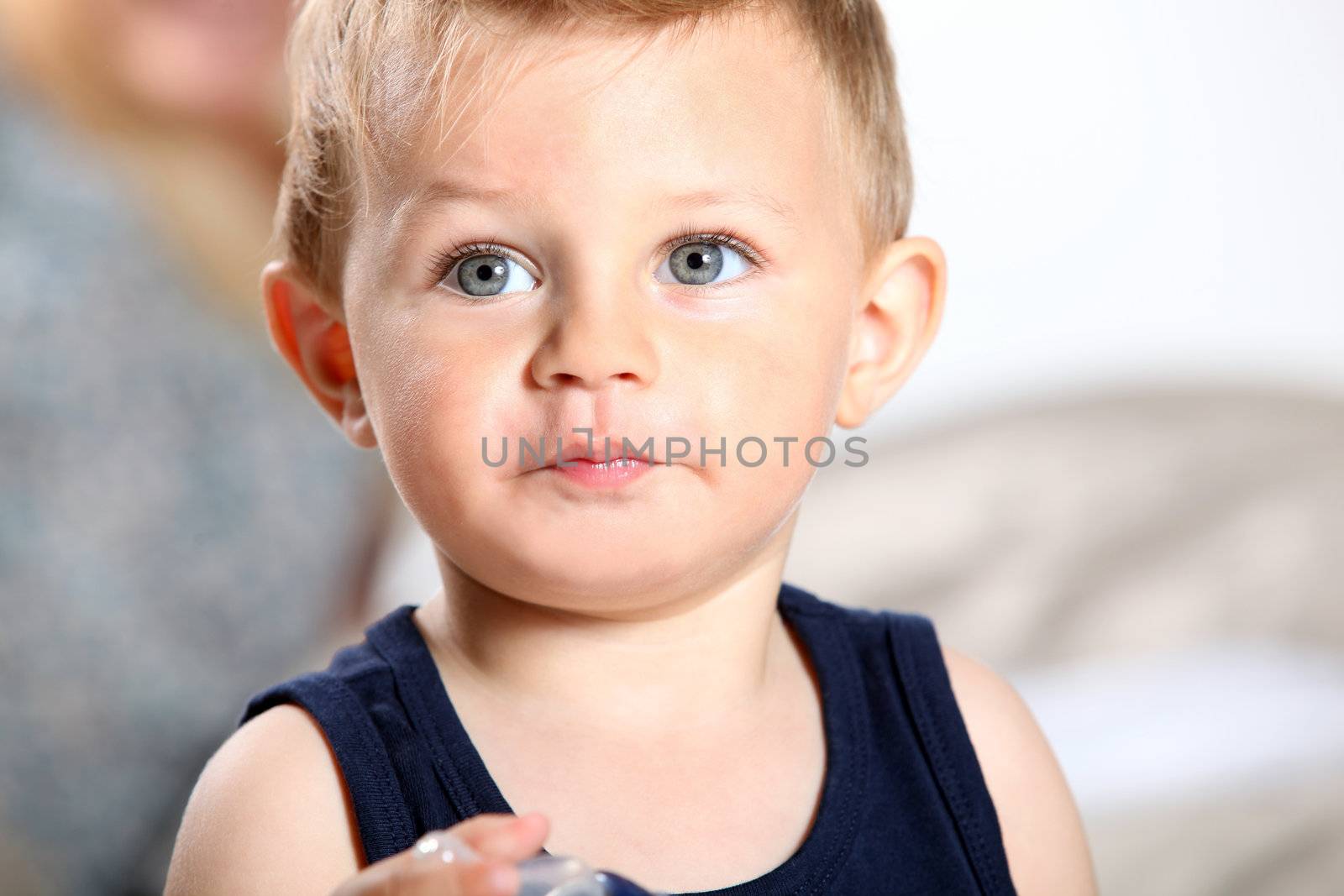 Young boy holding a teat by phovoir