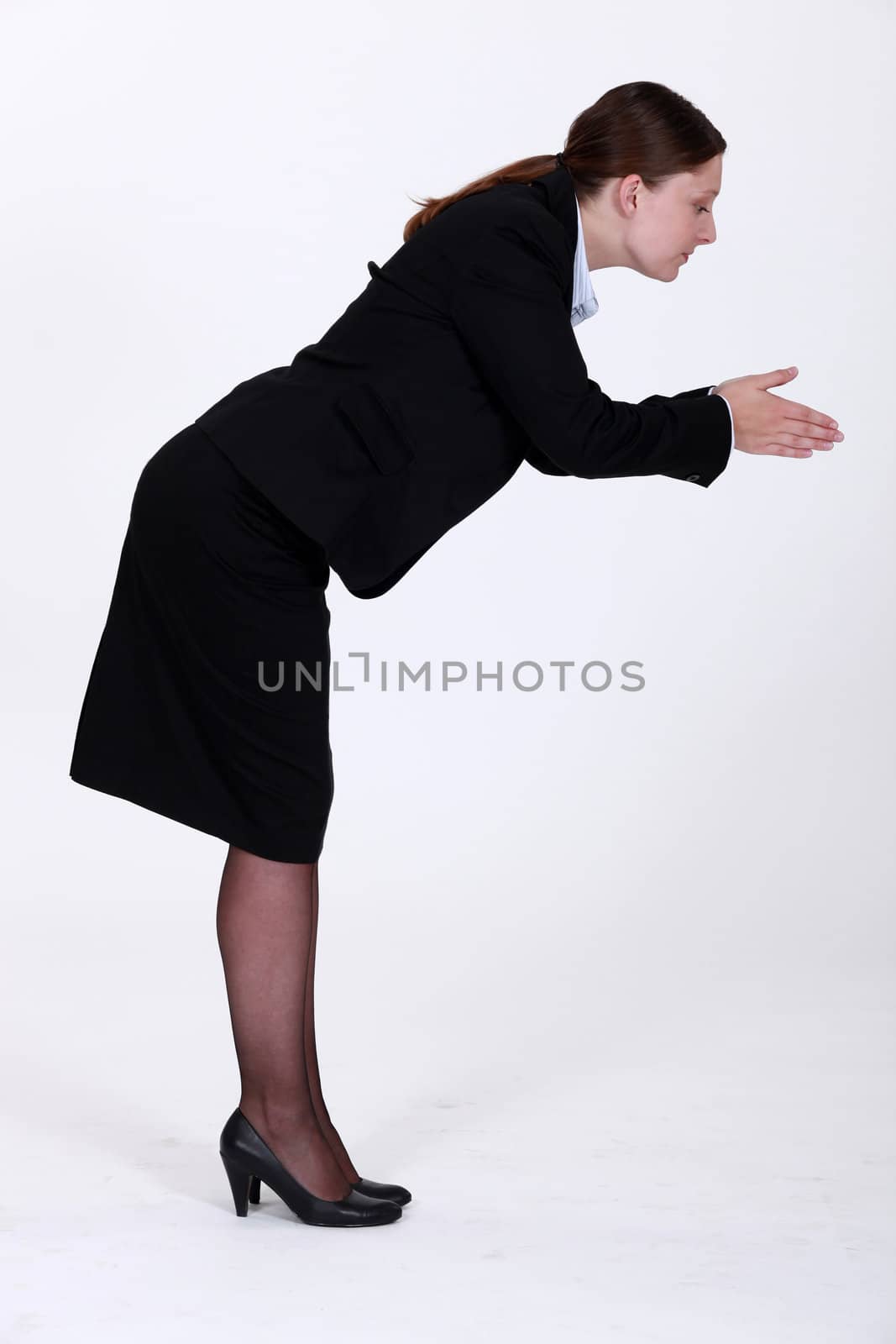 Black woman stood in a position to dive