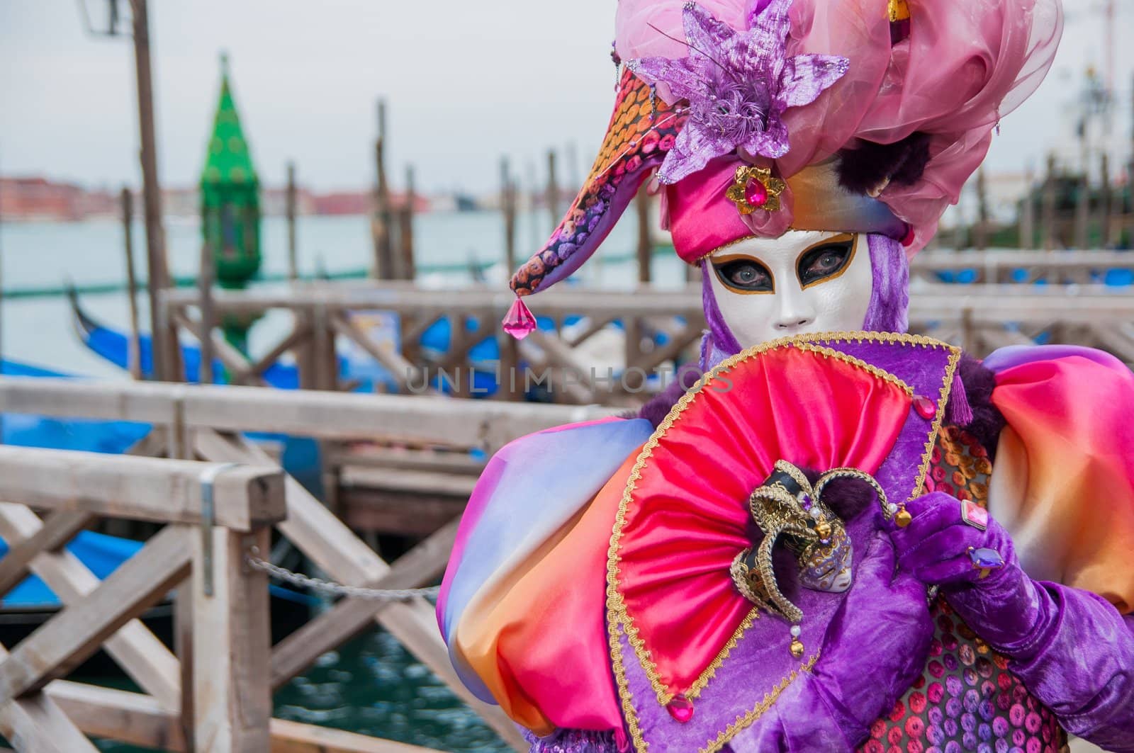 VENICE: An unidentified masked person in costume in St. Mark's Square during the Carnival of Venice, 2010.