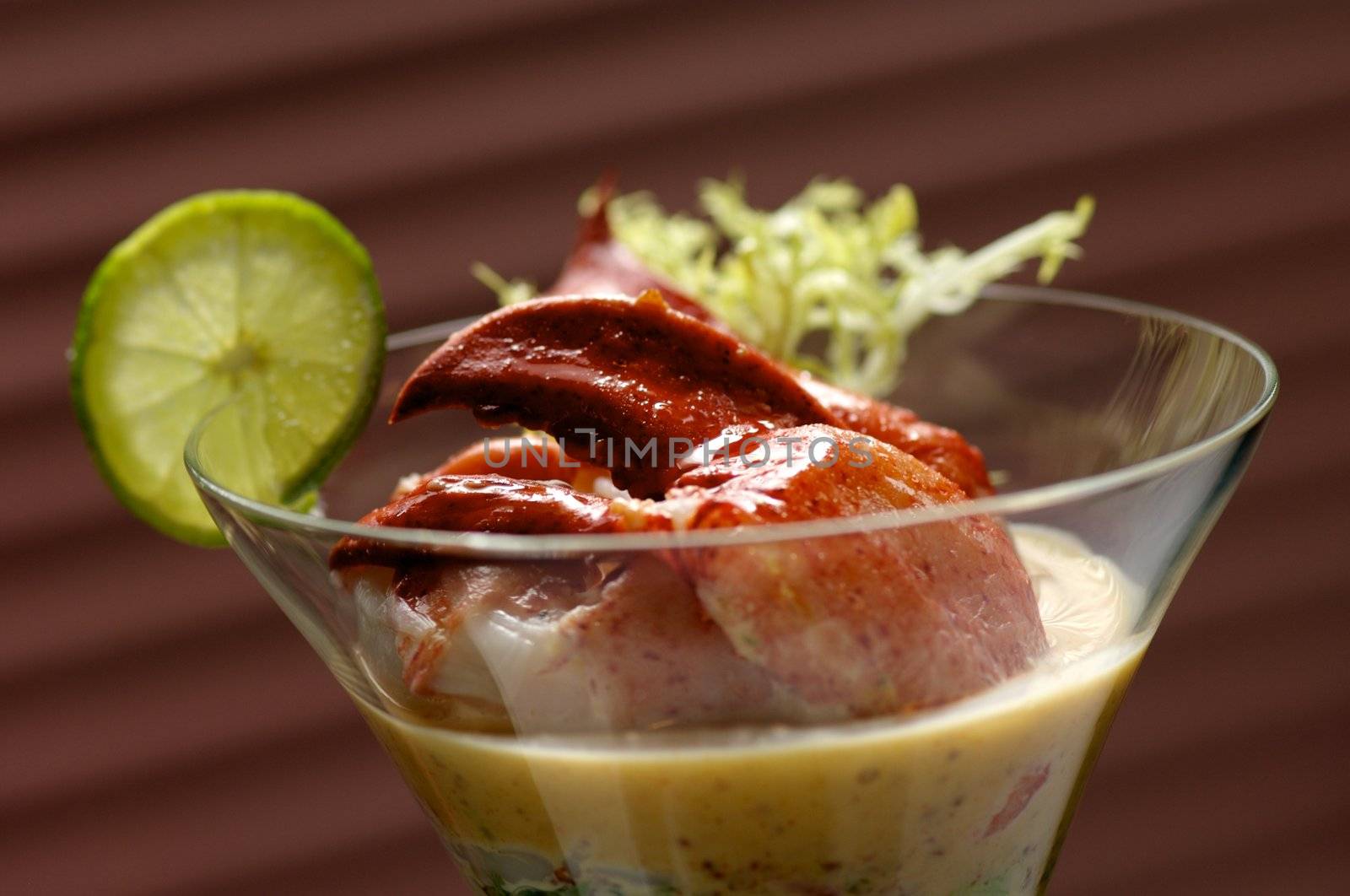 Image of lobster cocktail with sauce and lime garnish