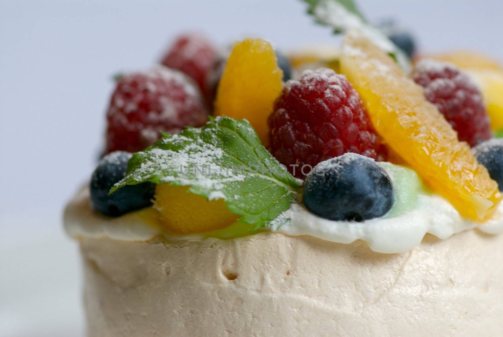 Image of merangue topped with mixed fruit