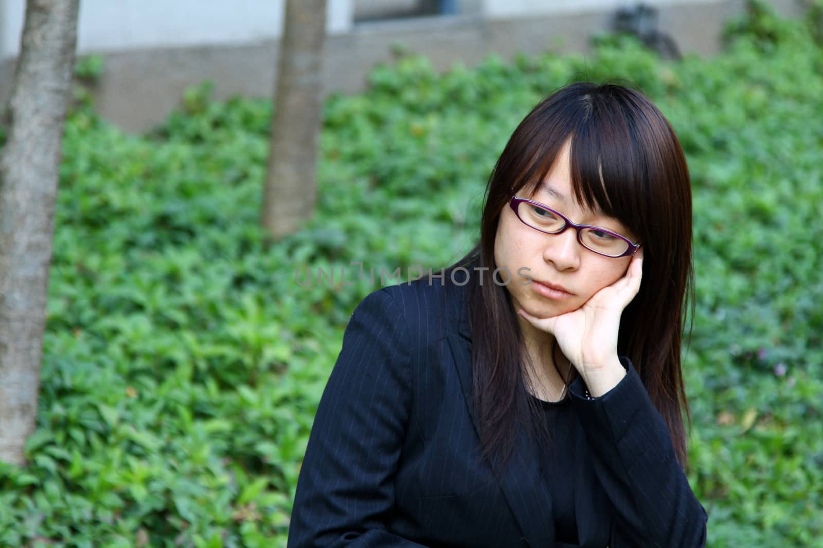 Businesswoman thinking outdoor by kawing921