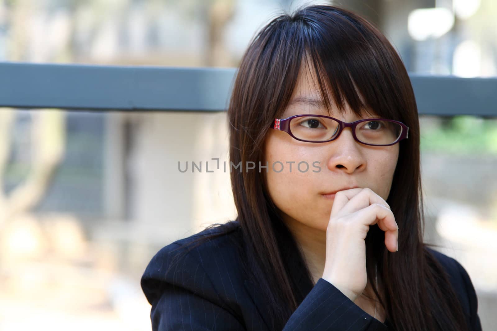 Businesswoman thinking outdoor by kawing921