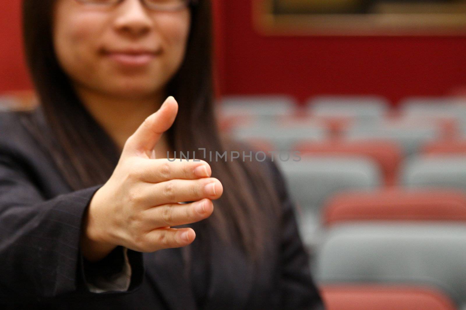 Asian businesswoman with shaking hand